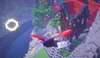 Mehrere Spieler fliegen mit Elytren durch eine Rennstrecke aus schwebenden Ringen.